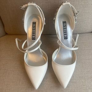Vera Wang “White” closed toe bridal pump.